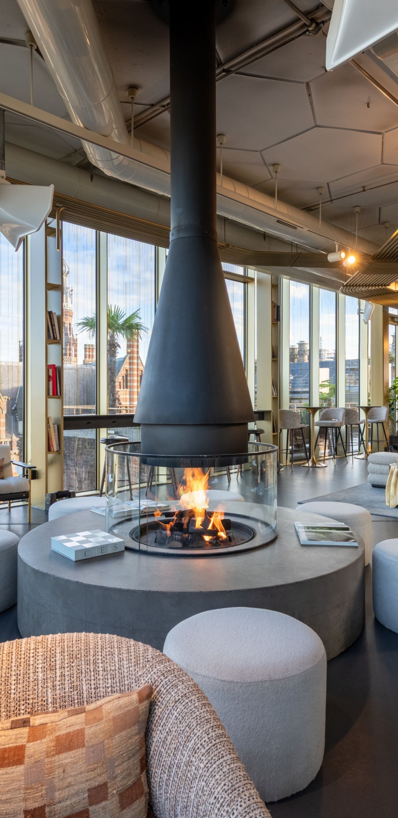 Cozy fireplace with seating and view in W Lounge