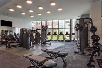 Fitness center with wall to ceiling windows.
