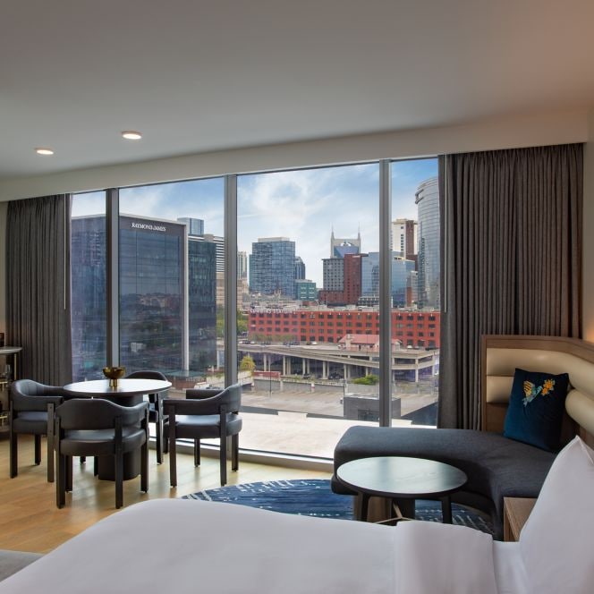Bedroom with dining table and view.