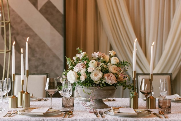 Table set with florals and candles.