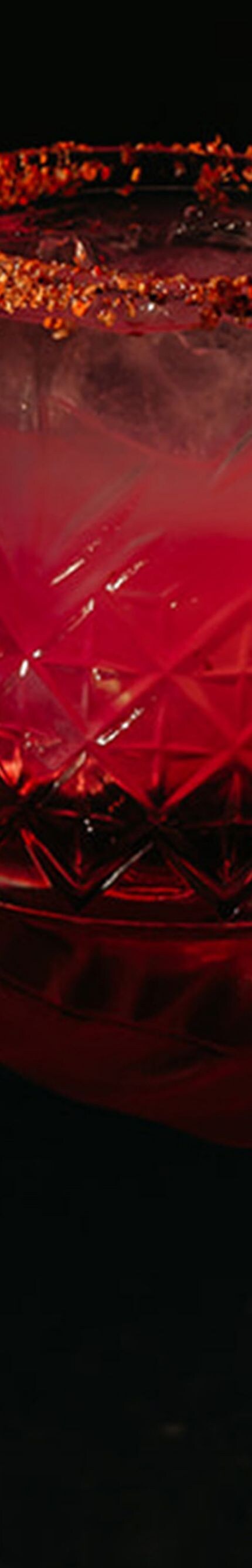 Cocktail in red glove with chili rim