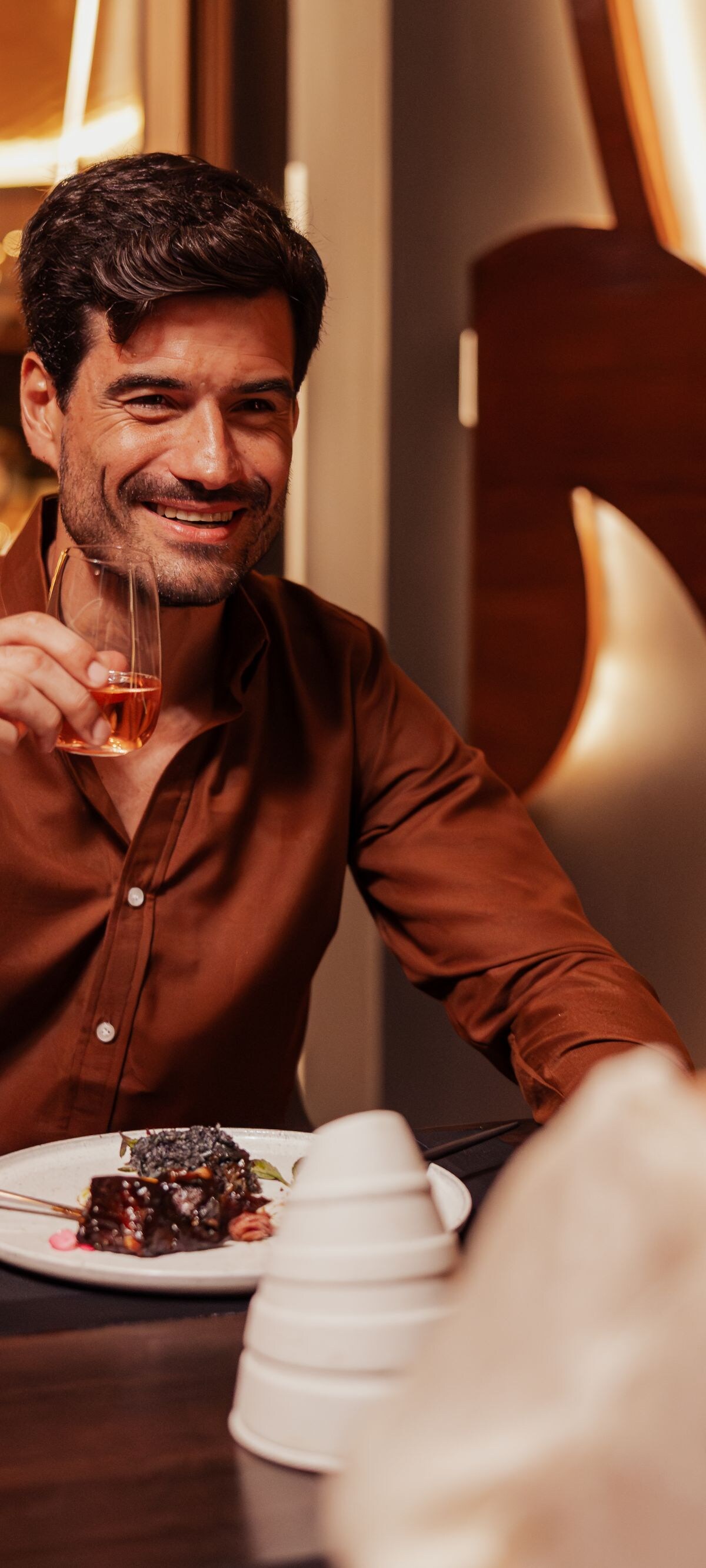 Couple having dinner and drinks at restaurant