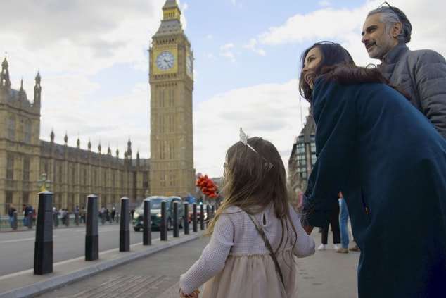 Family exploring London with Big Ben nearby.