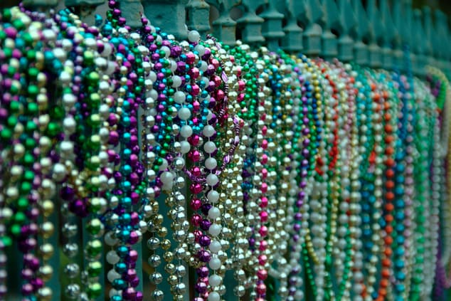 Beads aligned on fence in New Orleans
