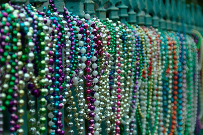 Beads aligned on fence in New Orleans