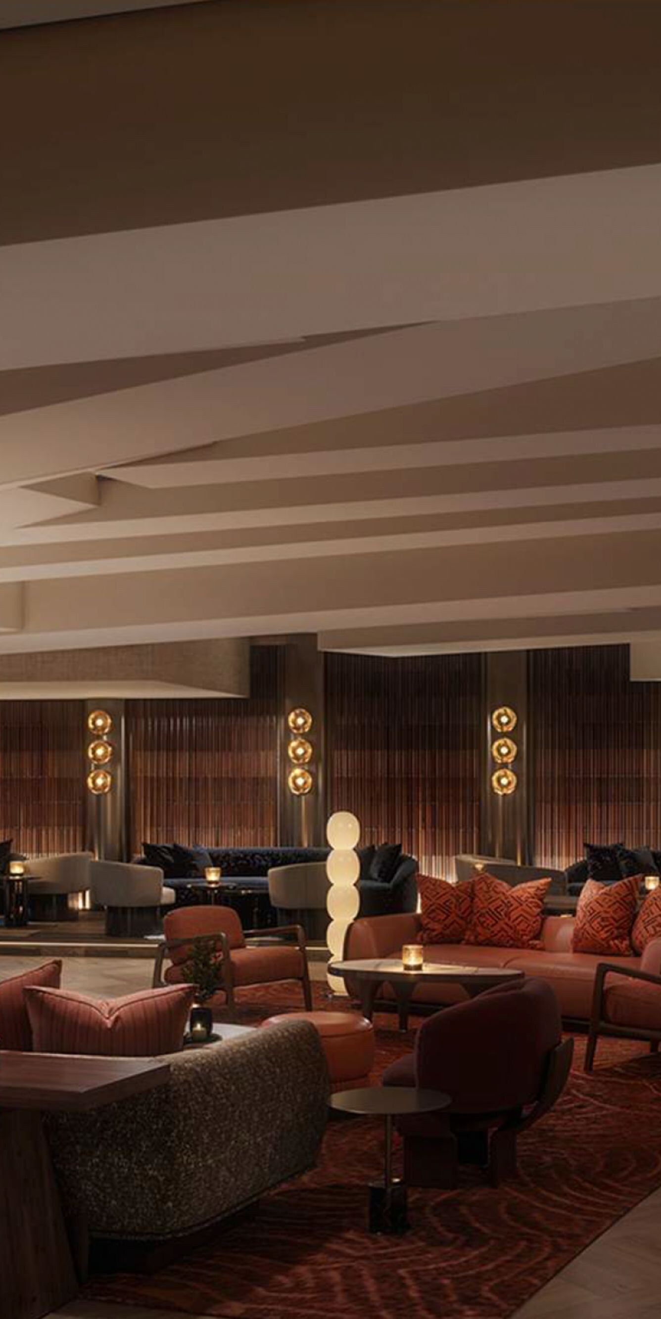Hotel lobby seating and bar in the evening