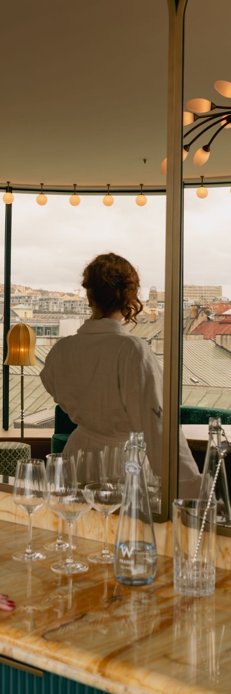 Two women unwinding in suite at the bar.  