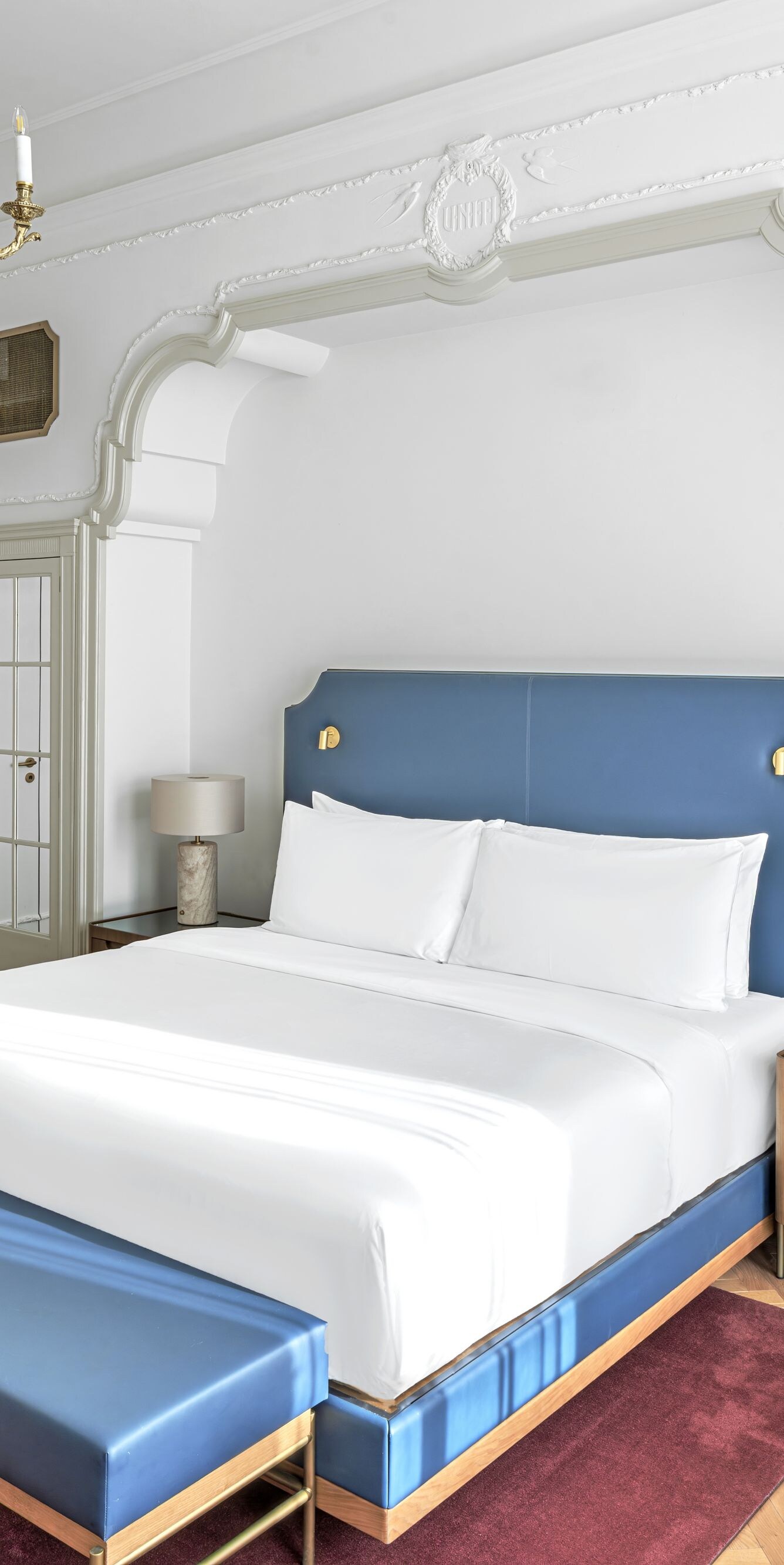 View of king bed, mirros and sitting areas