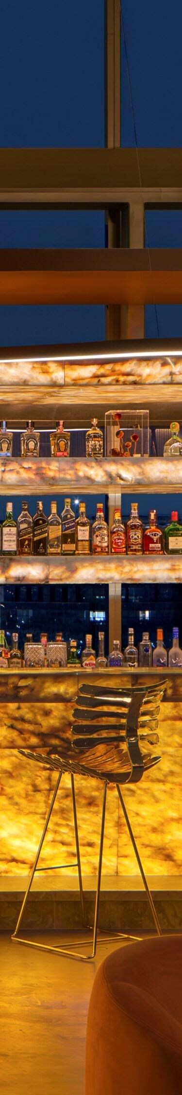 Baio's bar, drinks, stools at illuminated counter