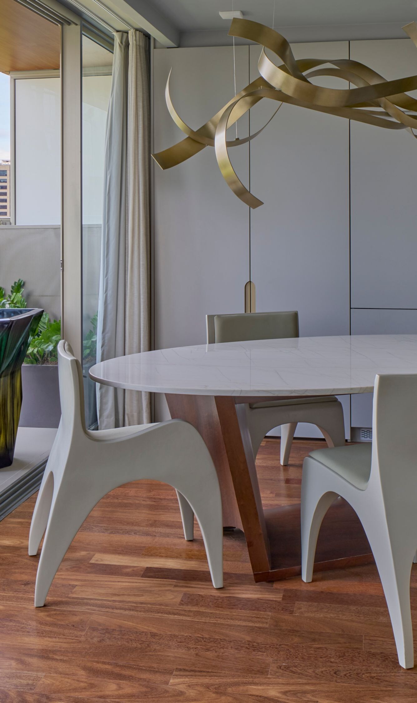 Dining room with table, chairs, kitchen and a view