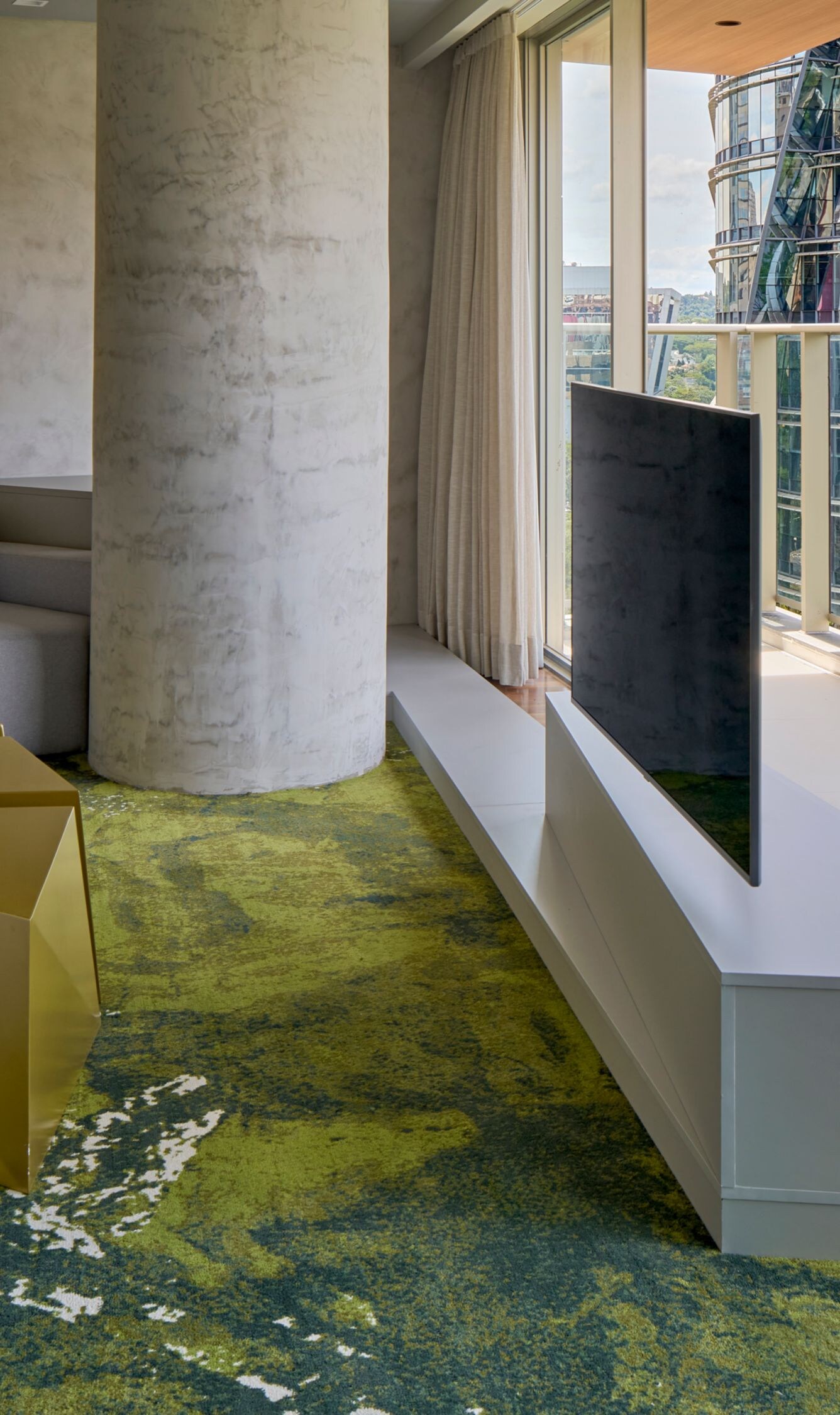 Living room with sofa, TV, painting and city view