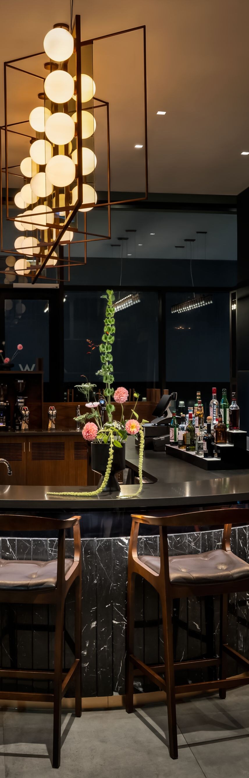 Modern bar with sculptural chandelier