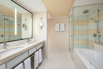 Double vanity, walk-in rain shower, tub