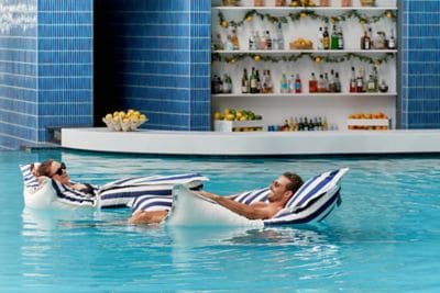 Couple lounging in a pool