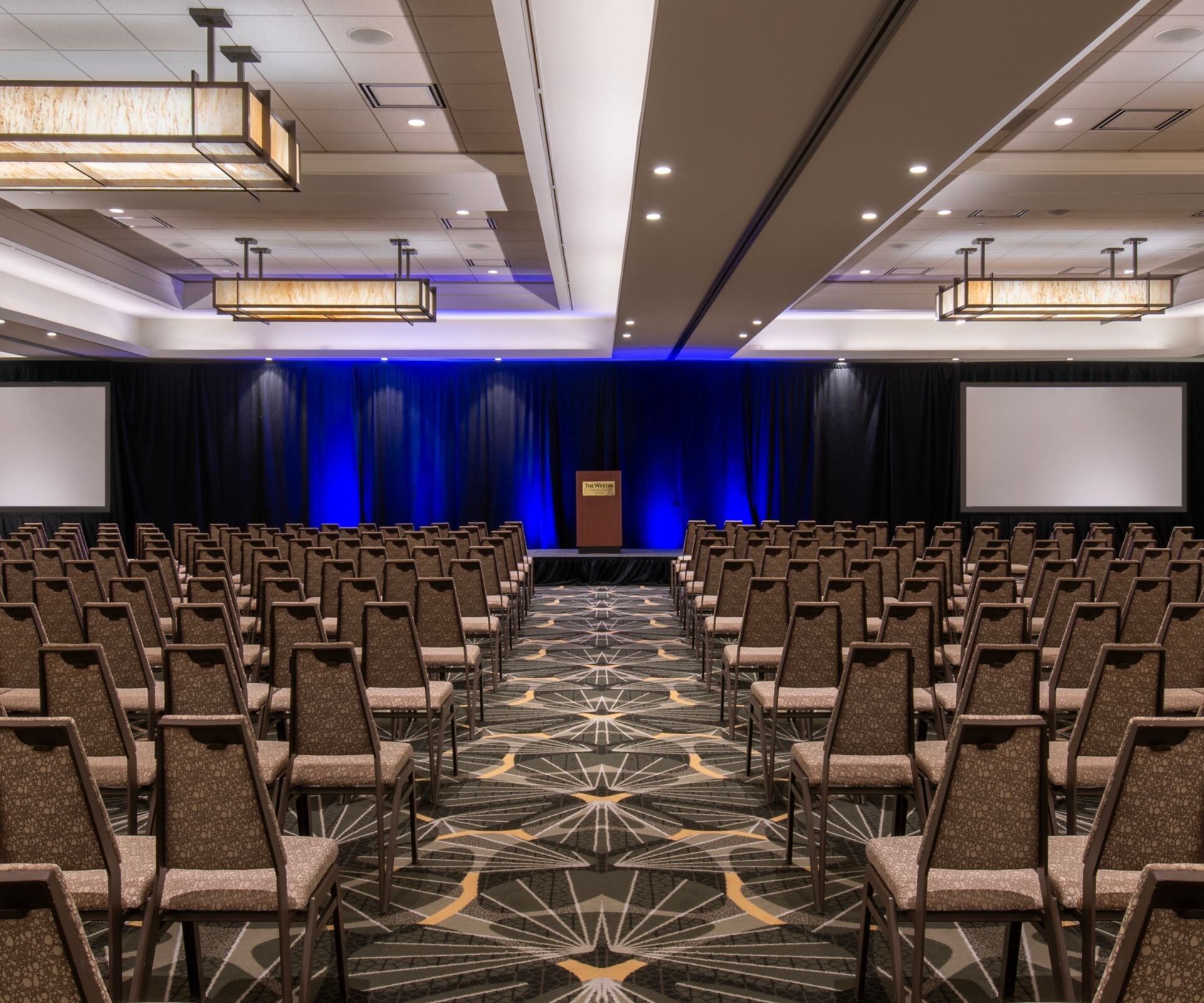 rows of chairs facing screens