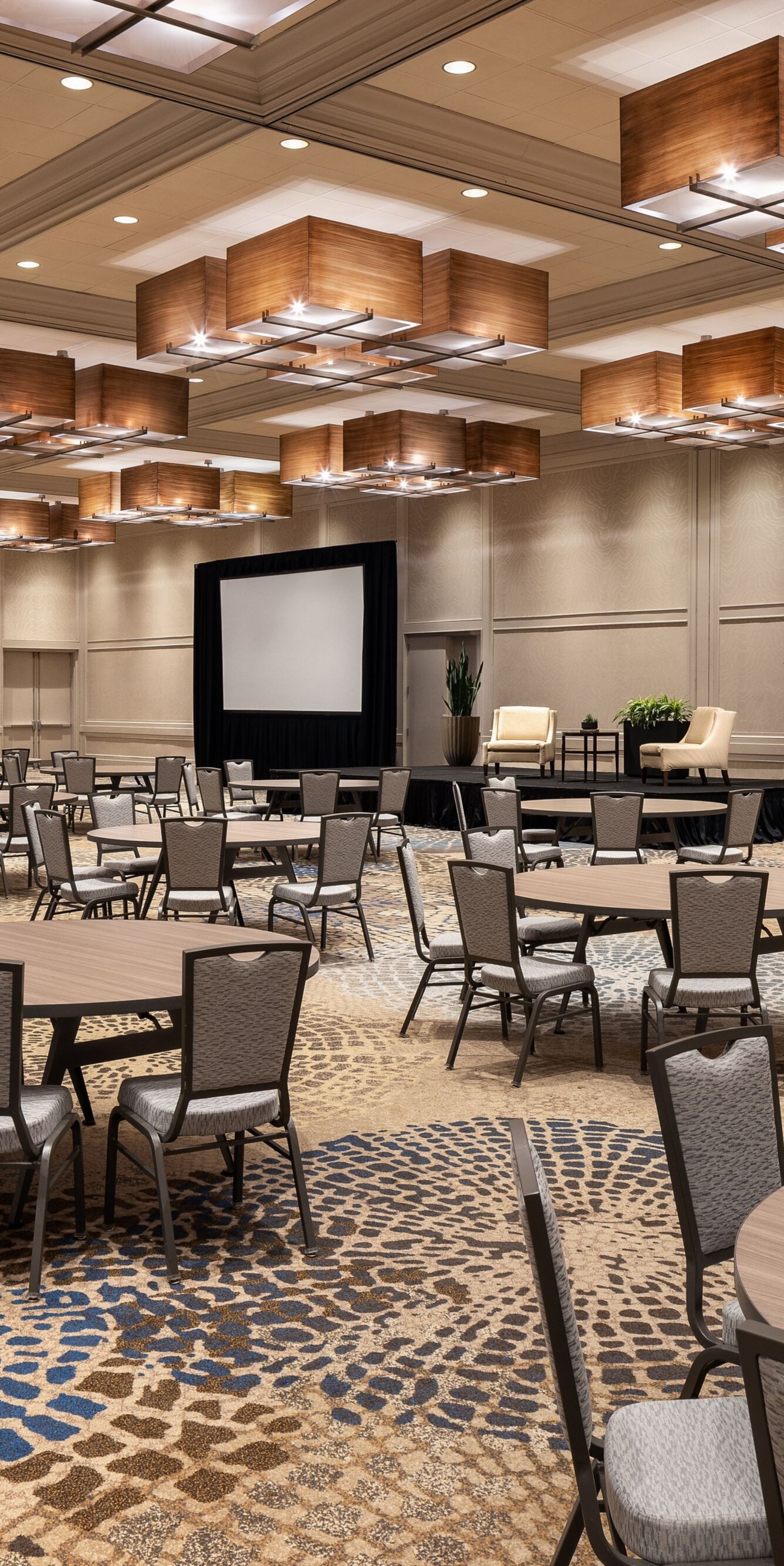 Ballroom with roundtables and screens
