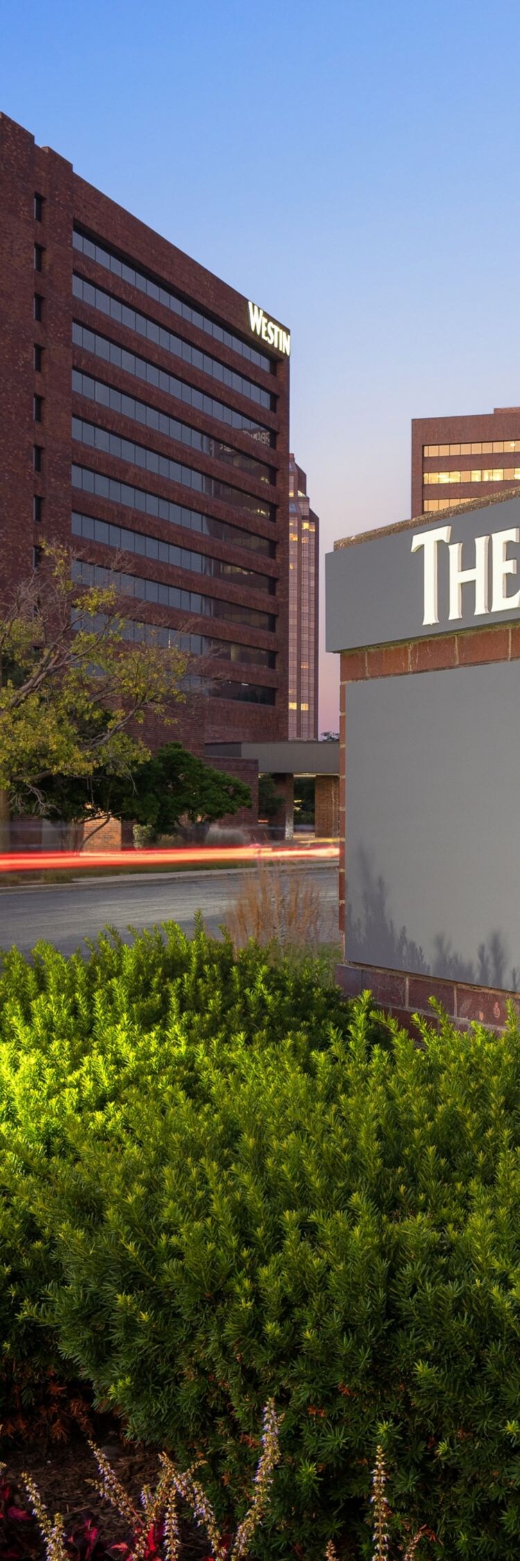 Property sign at hotel entrance