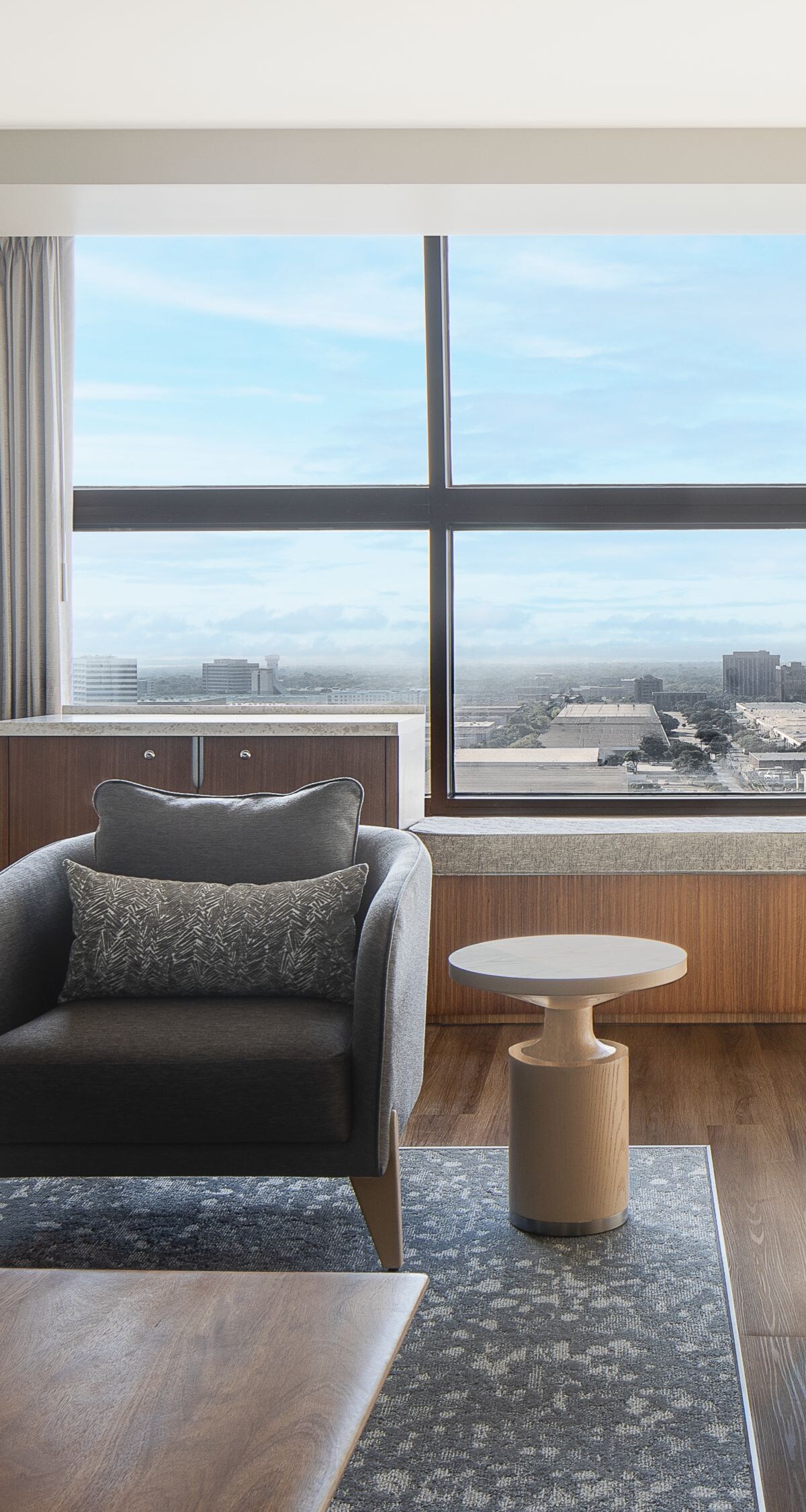 living area with sofa, chair and table