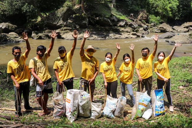 A group of people volunteering to pick up trash