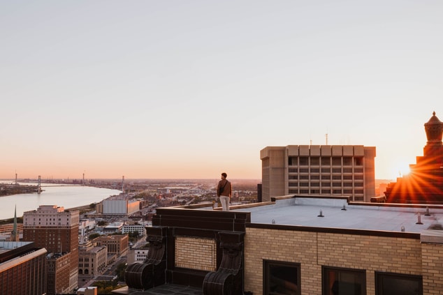 Rooftop views with sunset and skyline. 