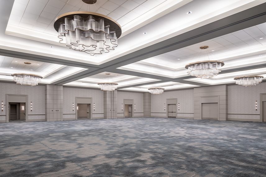 Ballroom with unique round glass chandeliers. 
