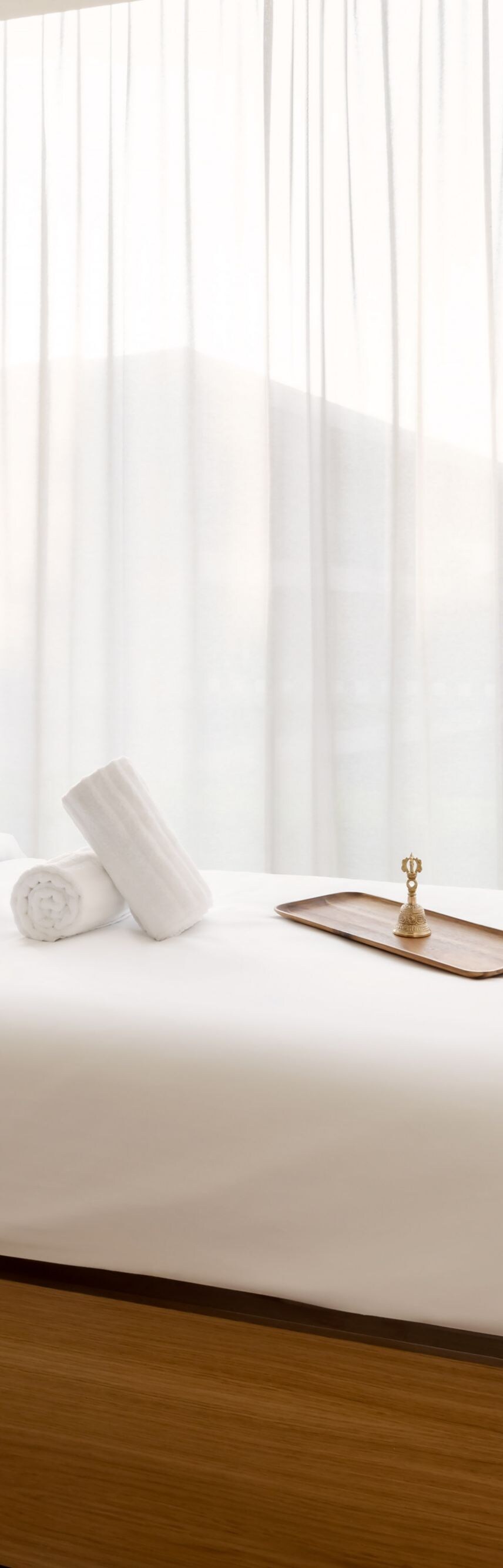 Individual spa treatment room with massage bed at 
