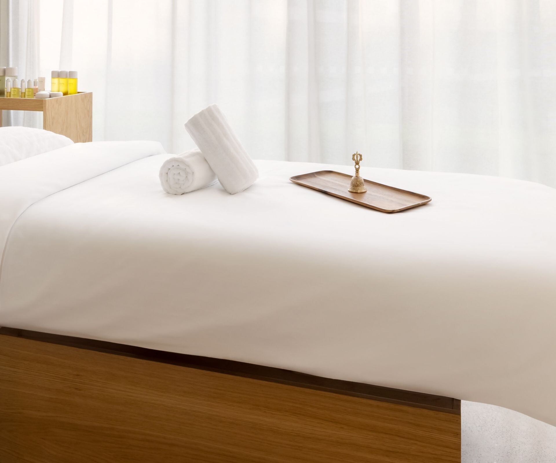 Individual spa treatment room with massage bed at 