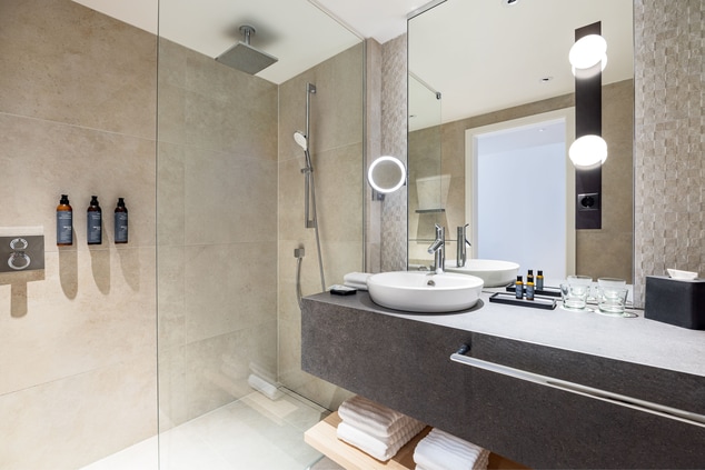 Light and modern bathrooms with walk-in shower