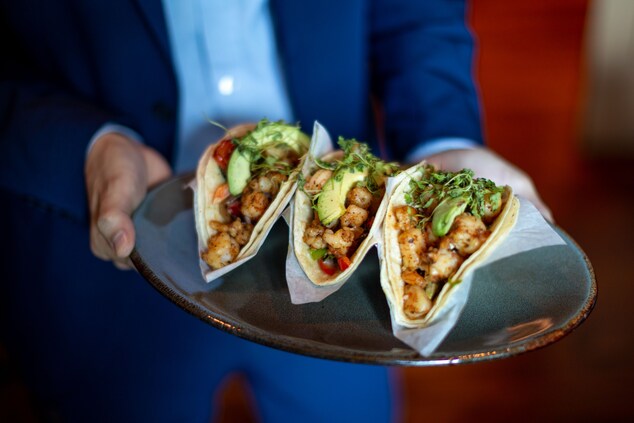 Three tacos on a platter