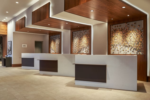 Front desk pods with lighting and decor