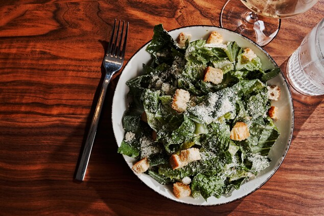 Caeser Salad with croutons and utensils