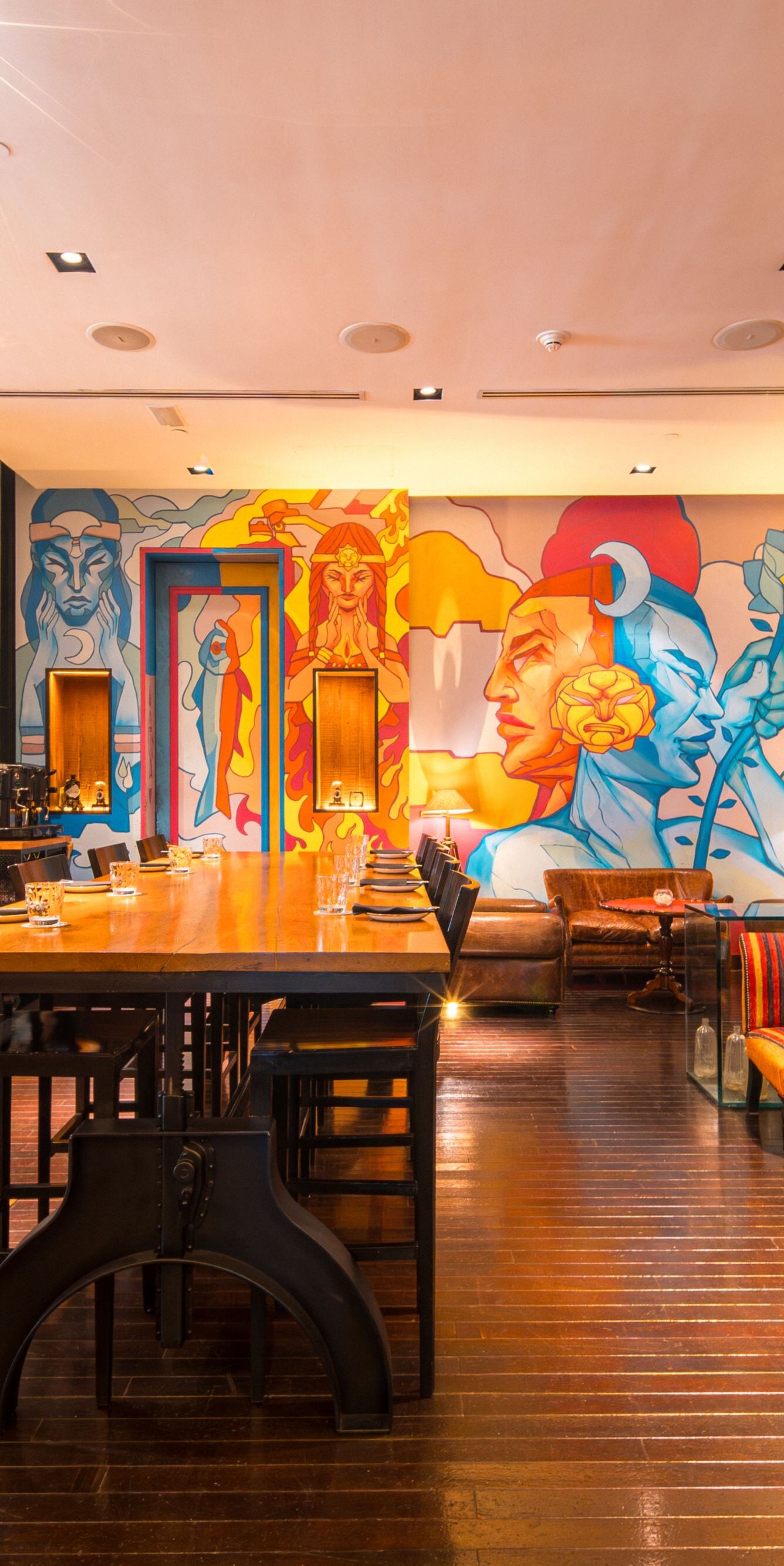 Restaurant dining space with mural