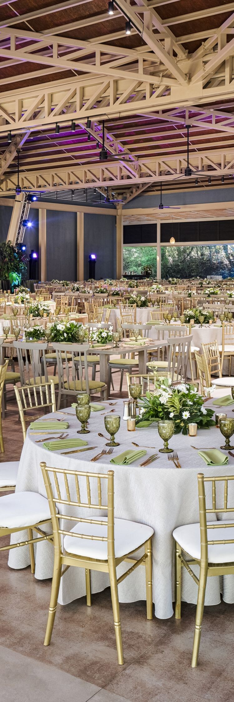 Large meeting space set with round tables