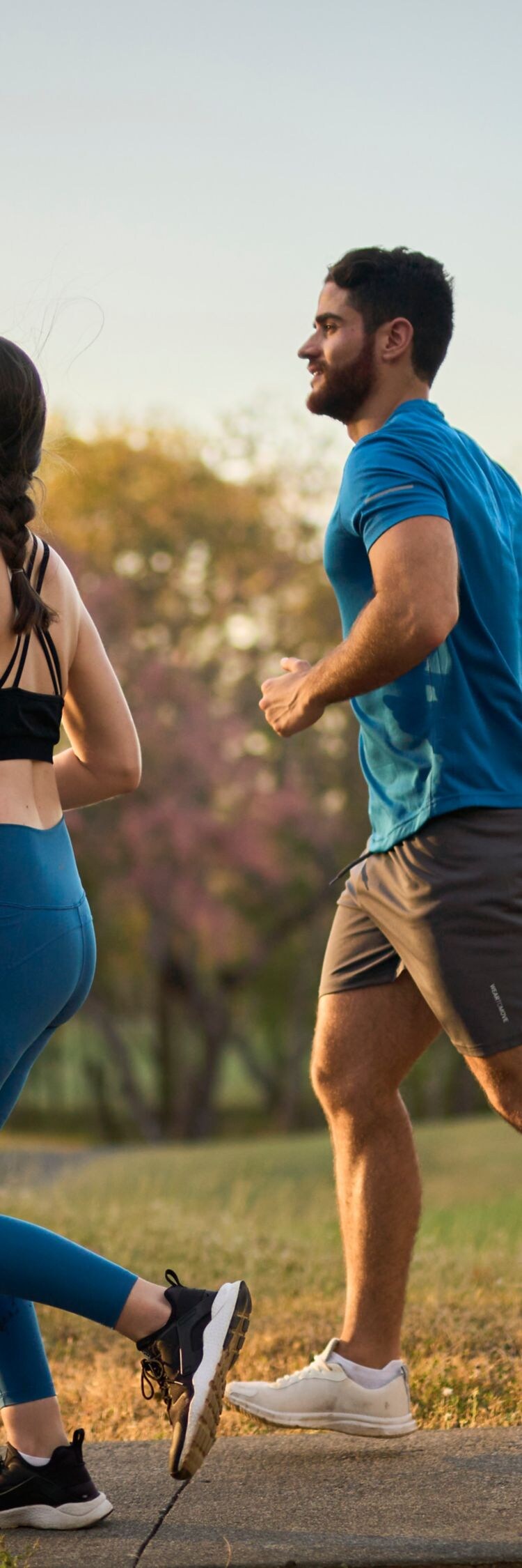 Couple running outdoors. 