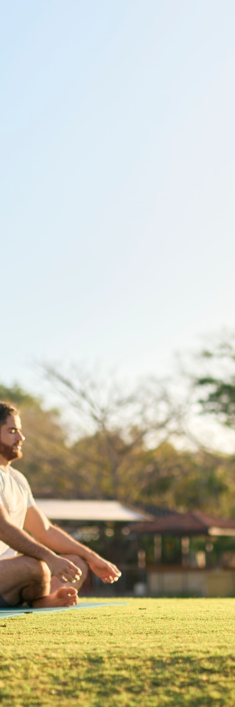 Yoga couple meditating outdoors