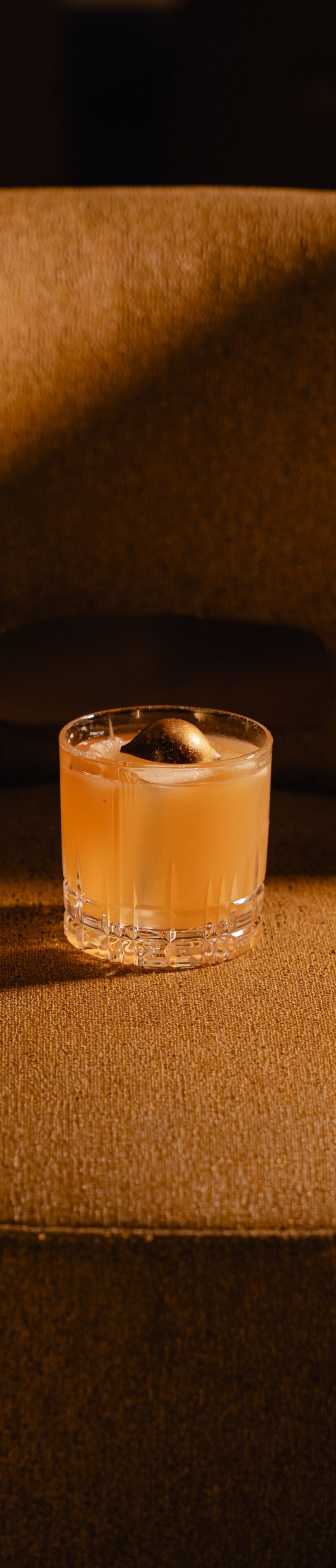 Cocktail positioned on bar seat 