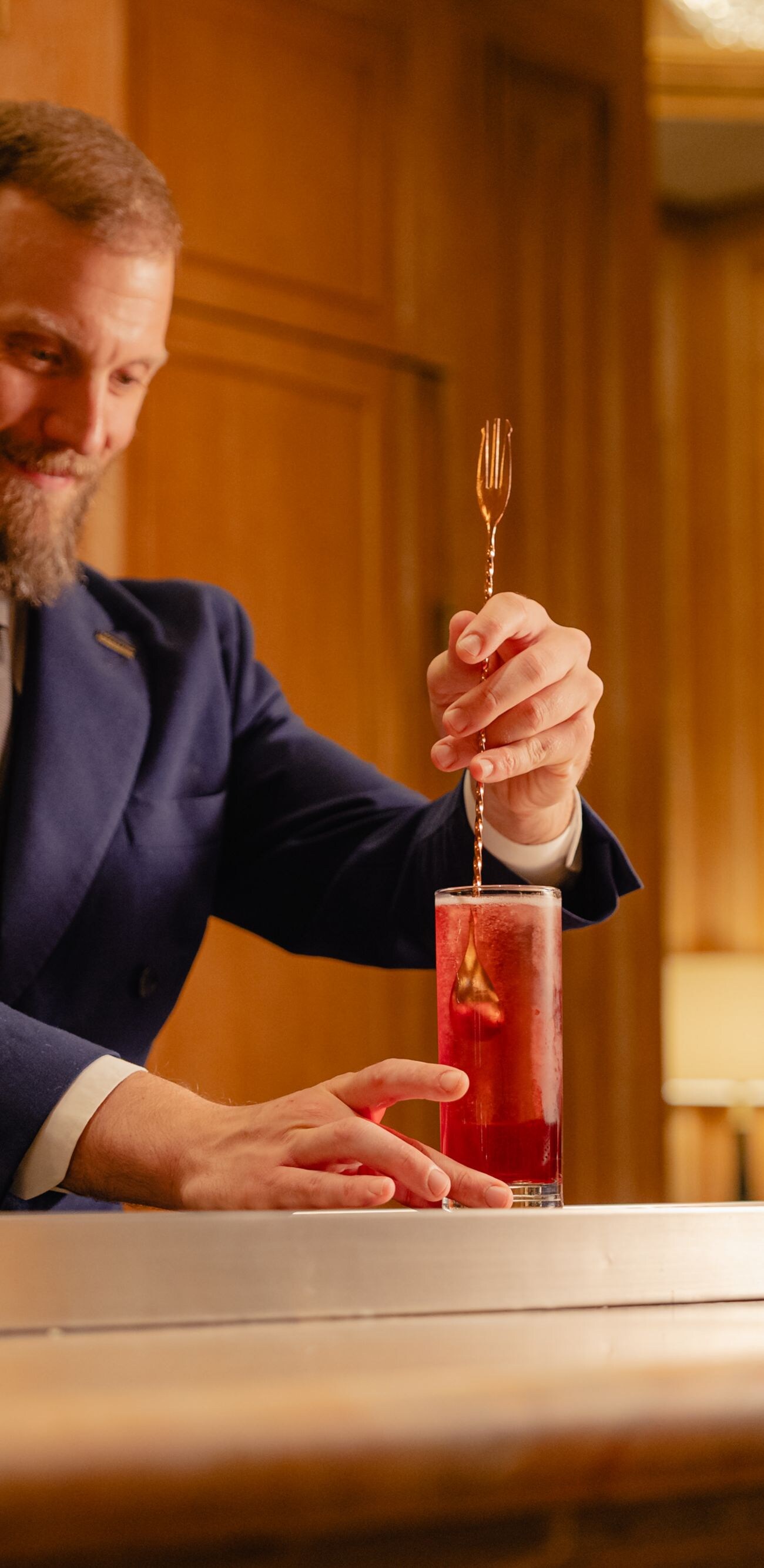 Barman stirring a cocktail