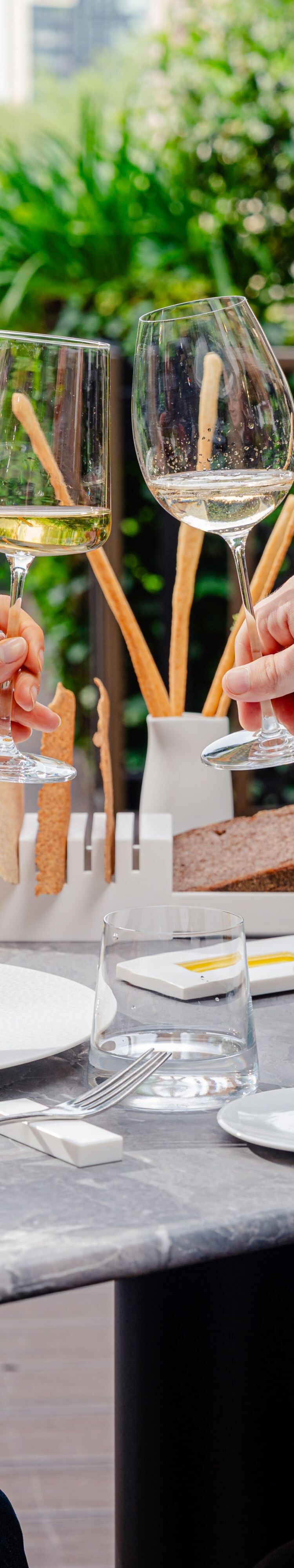 Guests dining at a table with wine glasses