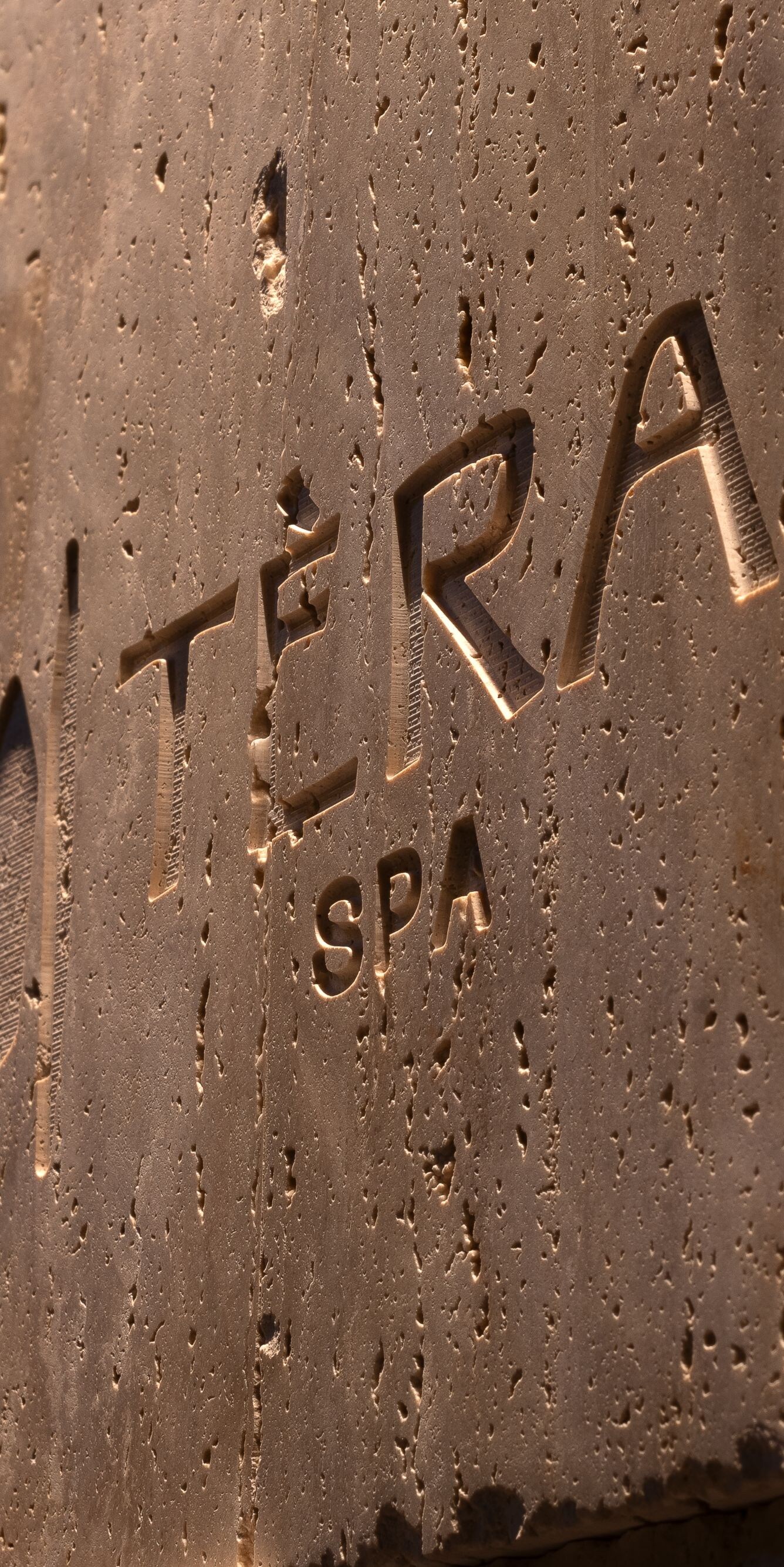 Detail of the spa logo carved in stone 