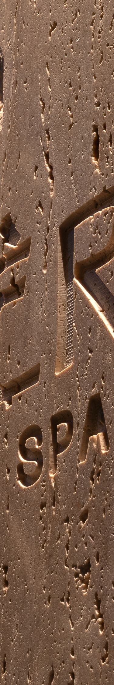Detail of the spa logo carved in stone 