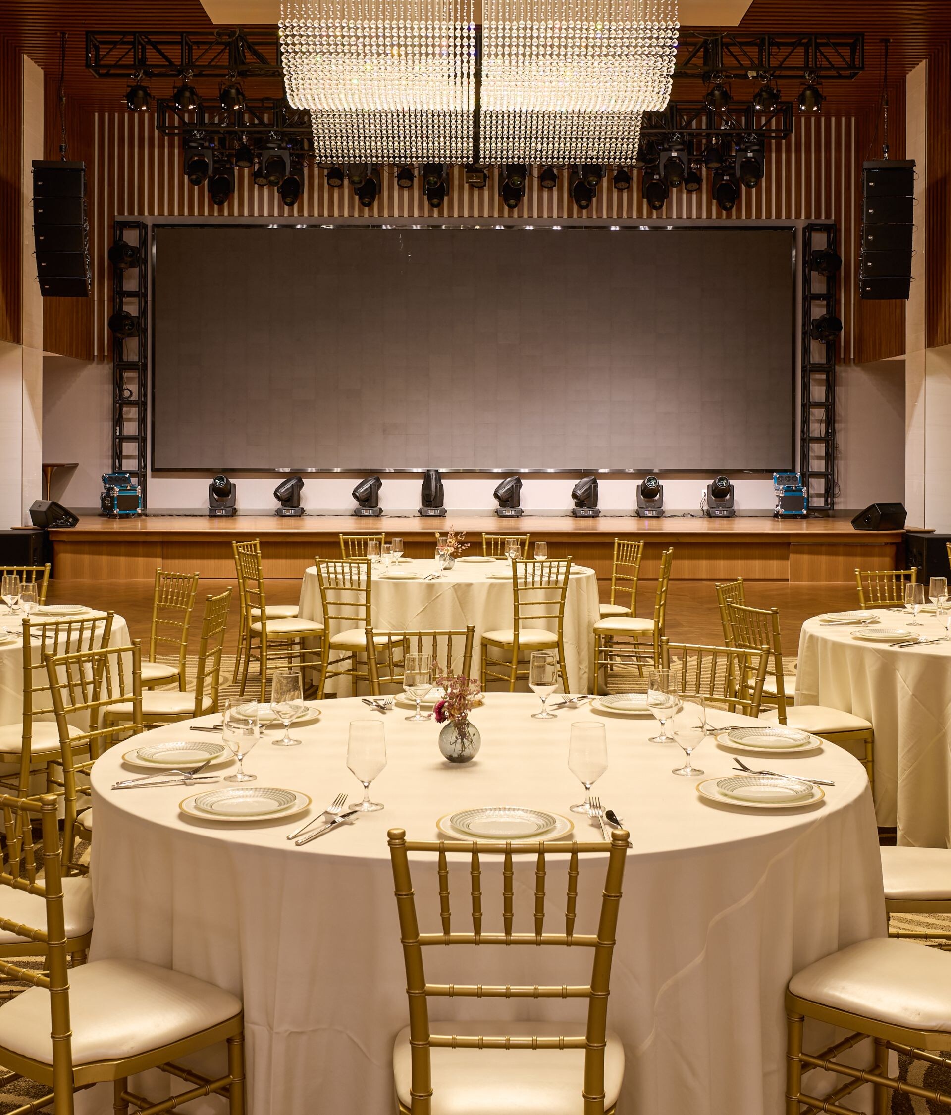 Ballroom event setup with stage and lighting