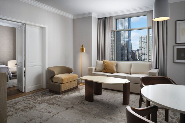 Executive suite living room with city view.