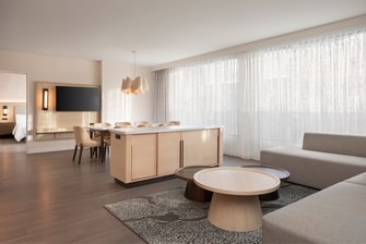 living area with dining table in background