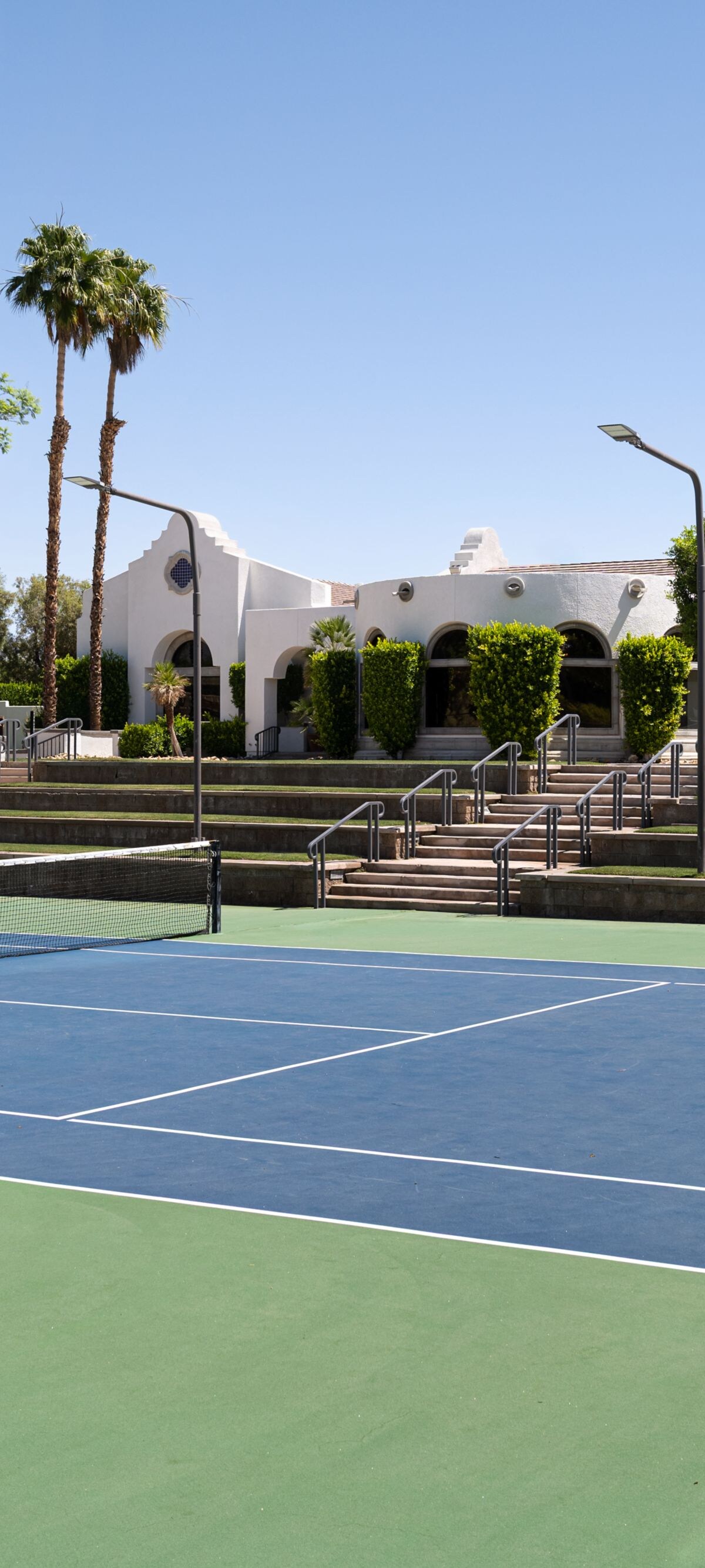 Rancho Mirage tennis court with palm trees 