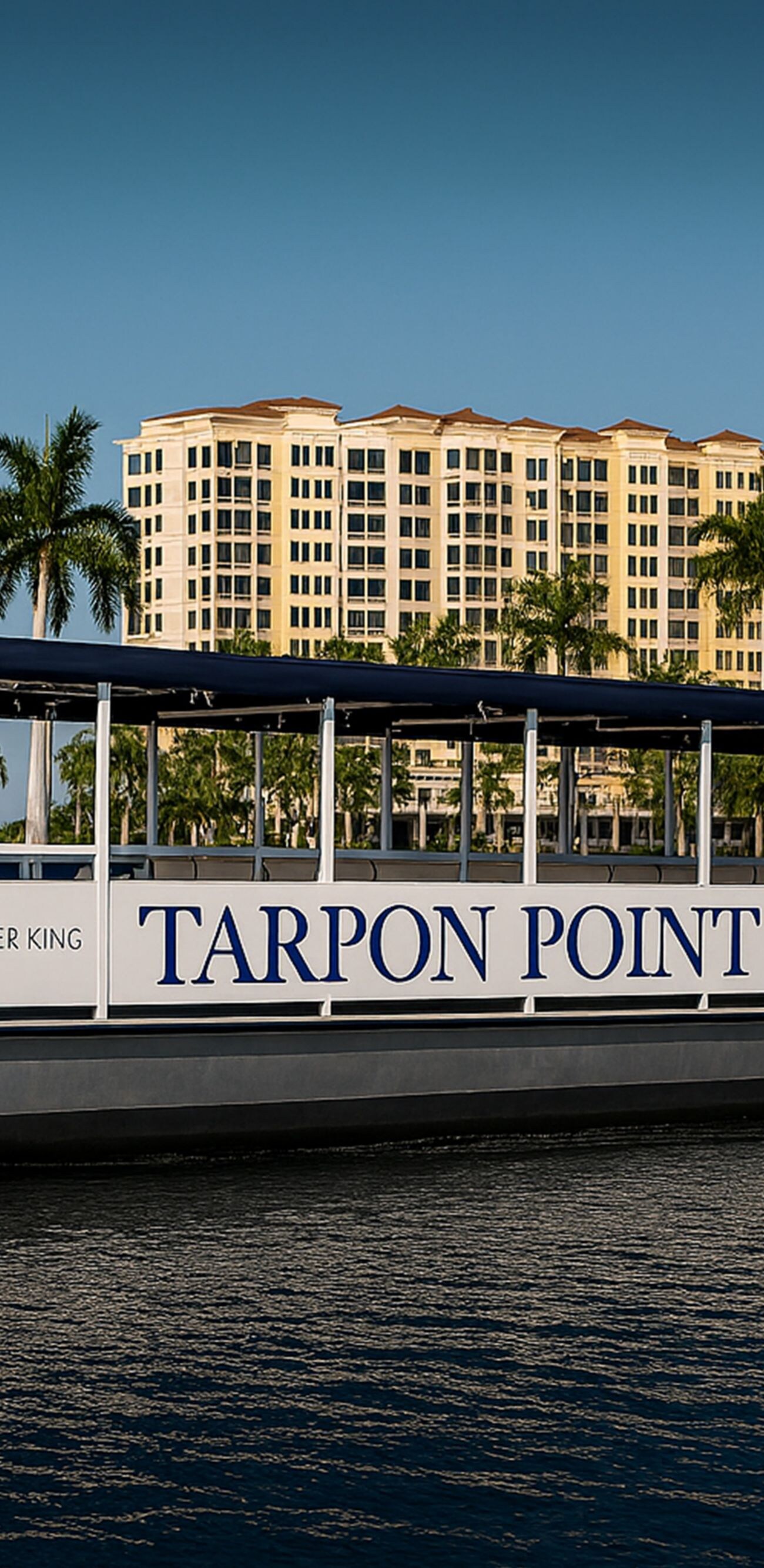 Pontoon boat on the water in front of docks