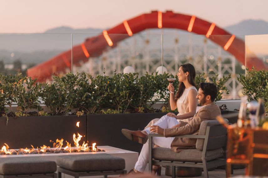 Couple drinking at rooftop bar