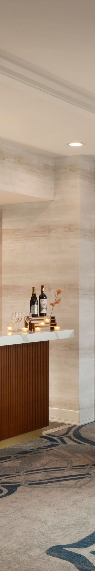 Indoor reception area with bar and cocktail tables