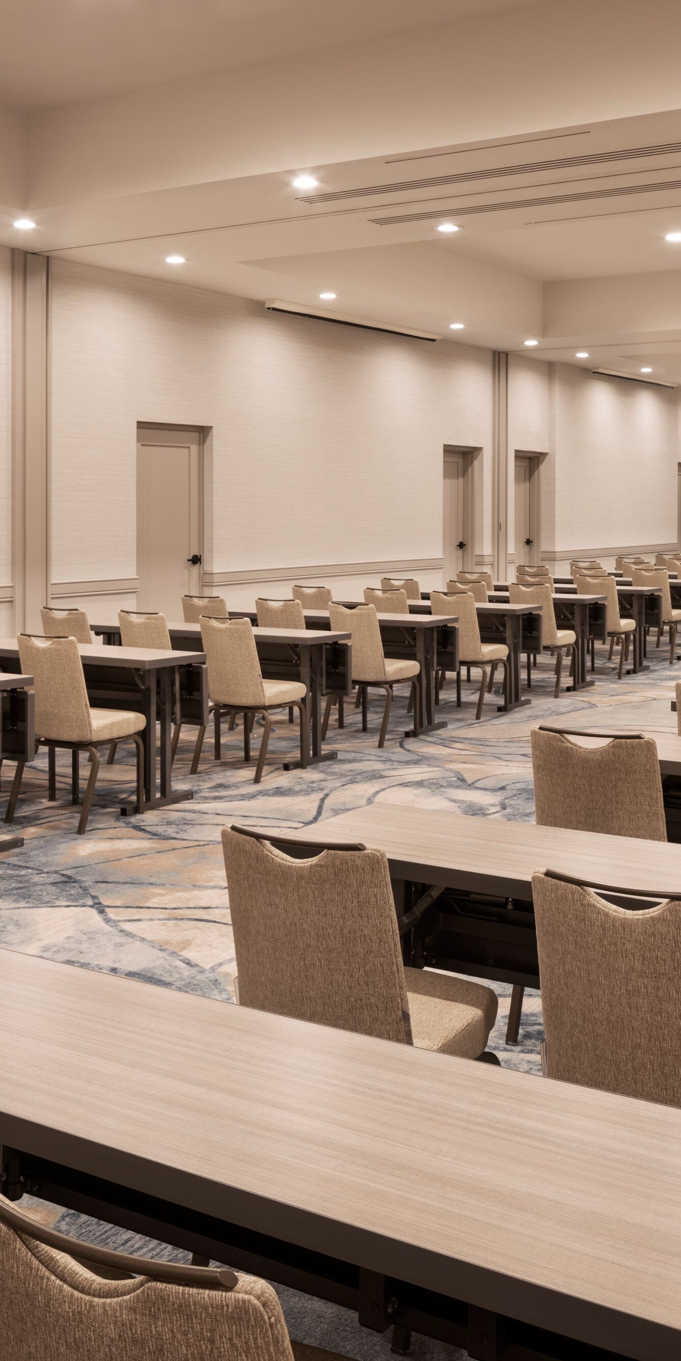Classroom‑style meeting room with rows of tables