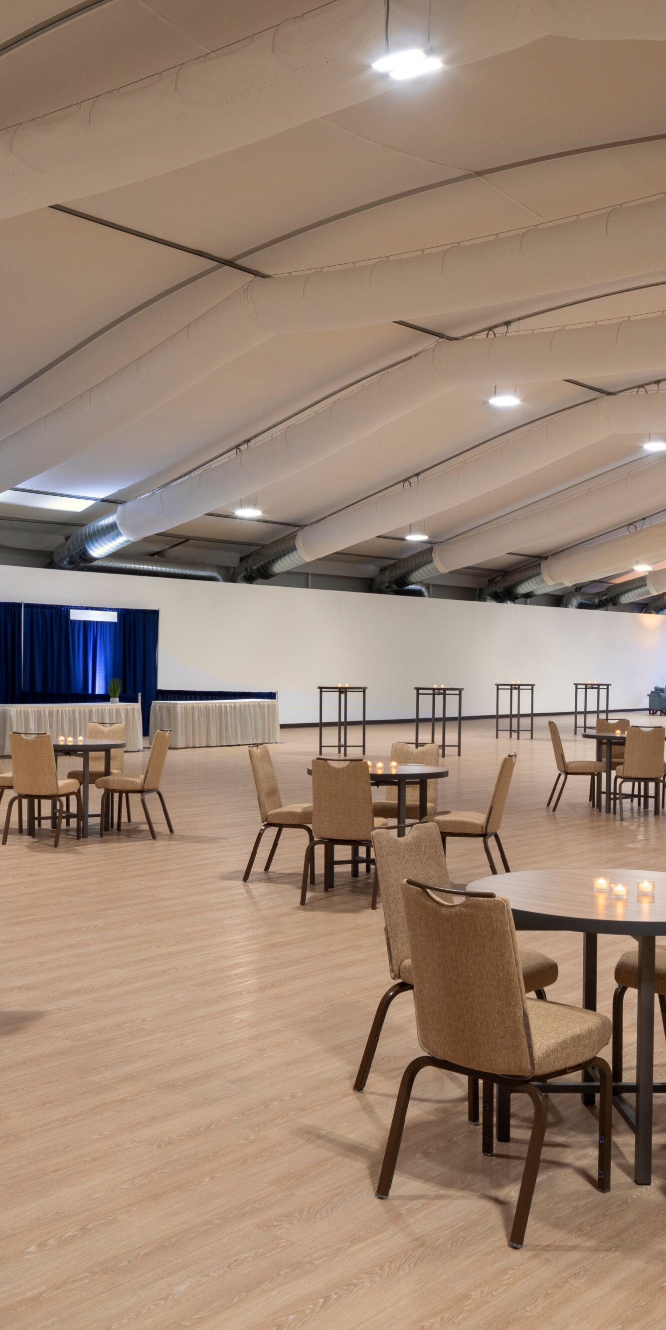 Spacious covered event pavilion with round tables