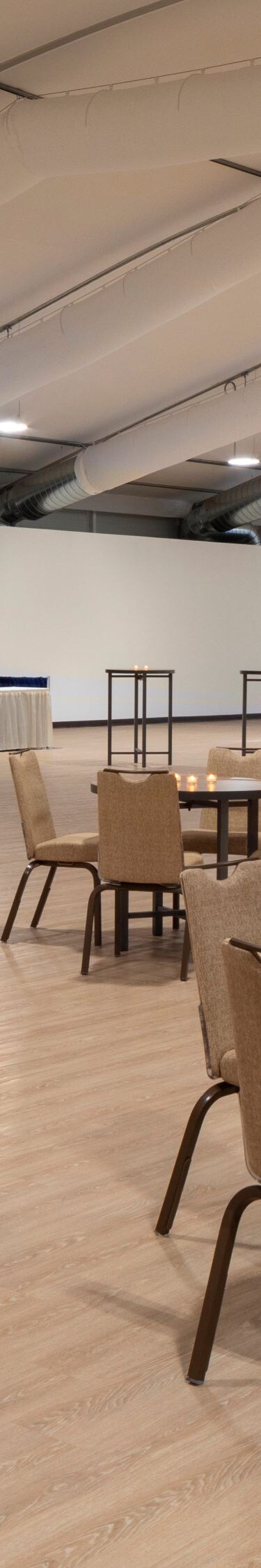 Spacious covered event pavilion with round tables